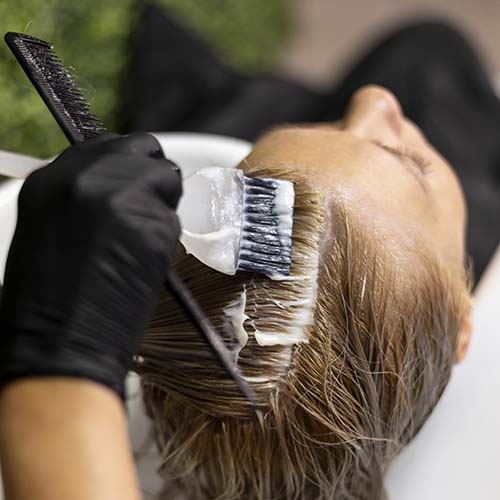 woman getting her hair washed dyed beauty salon